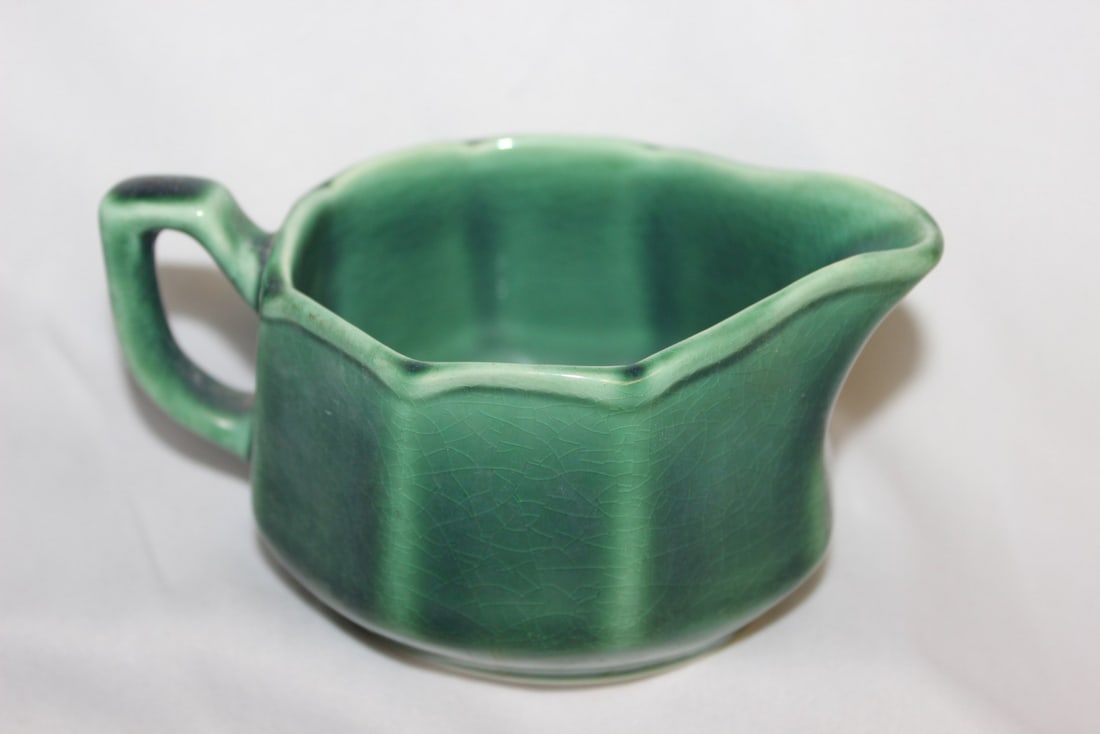 A Ceramic Creamer: 2 1/2" tall x 4" in diameter