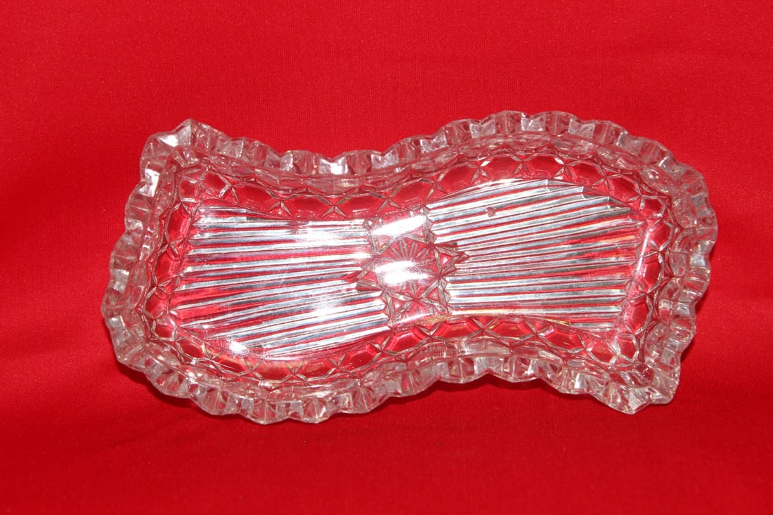 A Glass Jewelry Dish: 2" tall x 8" across