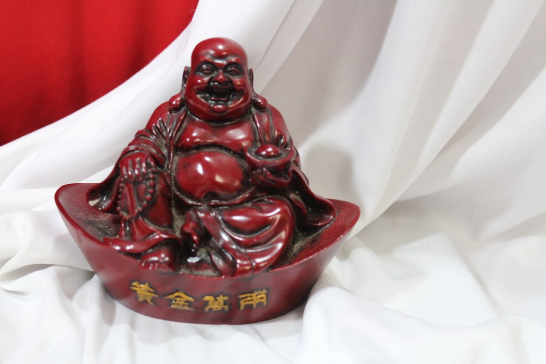 A Resin Buddha Figurine: 4 1/2" across