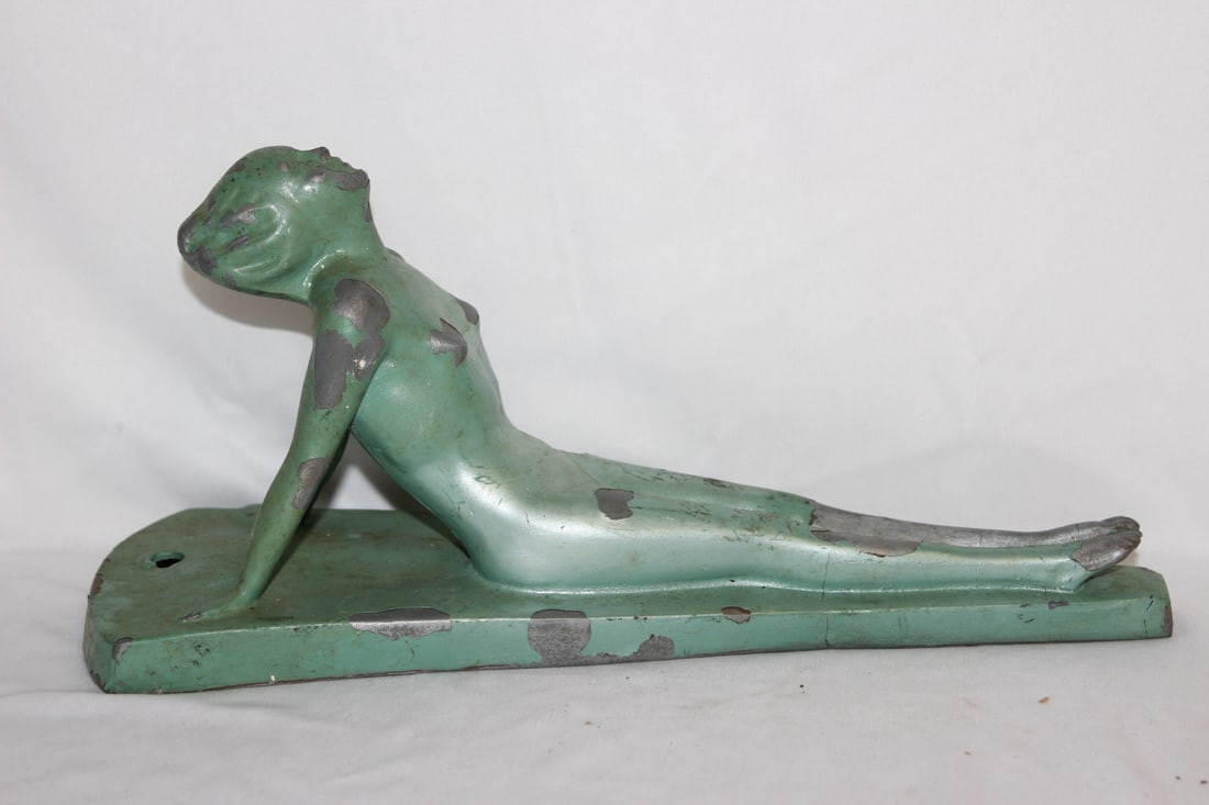 A Metal Art Deco Reclining Figurine: please note: paint loss - 12 1/2" long