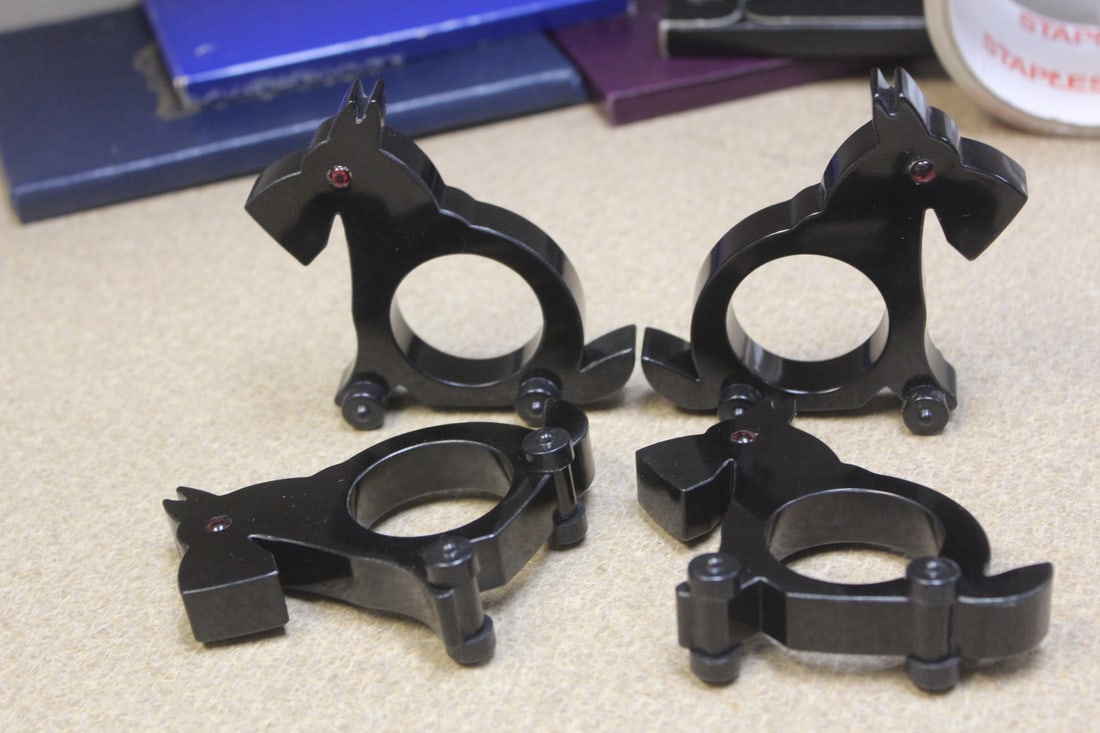 Lot or Set of $ Lucite Napkin Rings: on wheels - 3 1/4" tall each - dog motief - wheels work - rare -possibly older