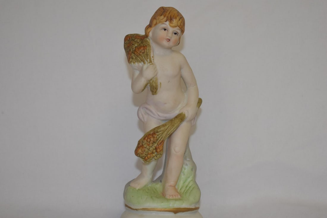 A Bisque Figurine: 6 1/4" tall