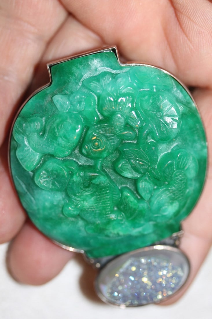 Sterling Nephrite and Geode Brooch Pendant: Sterling frame contains one 2" x 2 1/2" carved piece of nephrite, and what appears to be a quartz geode.