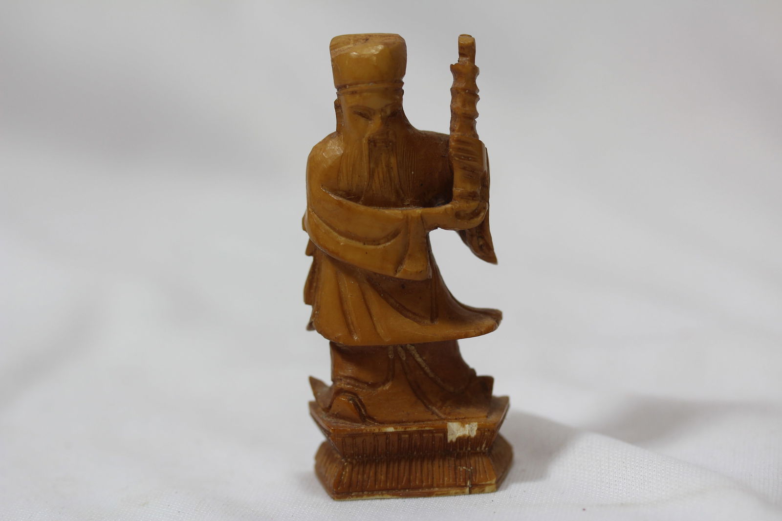 A Carved Bone Chess Piece: please note= chip - 2 1/2" tall