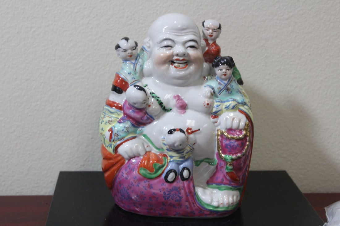 A Chinese Ceramic Buddha: Maker's mark on the bottom - 8 inches tall