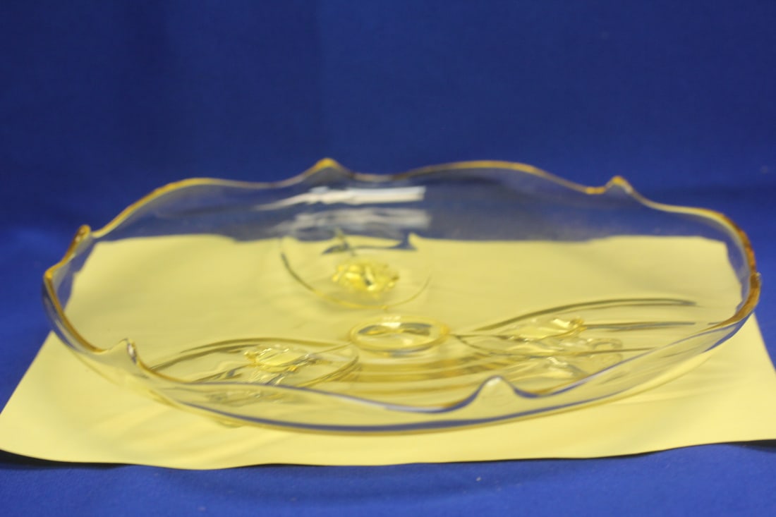 A Yellow Depression Glass Footed Plate: 10 1/2" in diameter