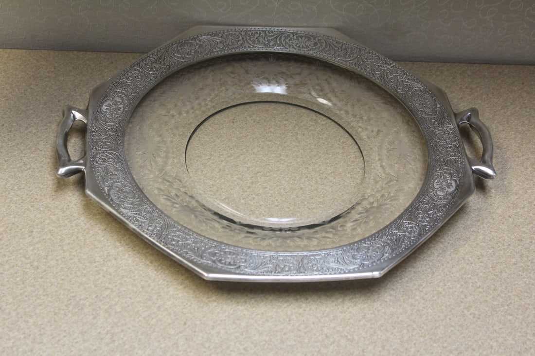 Two handle tray: marked "sterling" rim silver overlay, handle to handle measures 13 3/4" in diameter