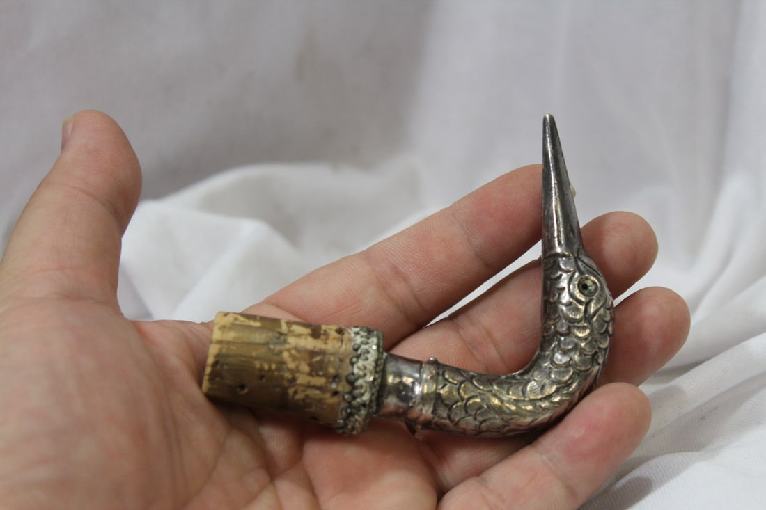 A Vintage Swan Head Cork Stopper: possibly sterling - 3 1/4" tall - please note: one glass eye is missing