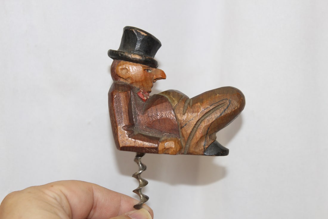 A Vintage German Wooden Figueral Cork Opener: overall= 5" tall