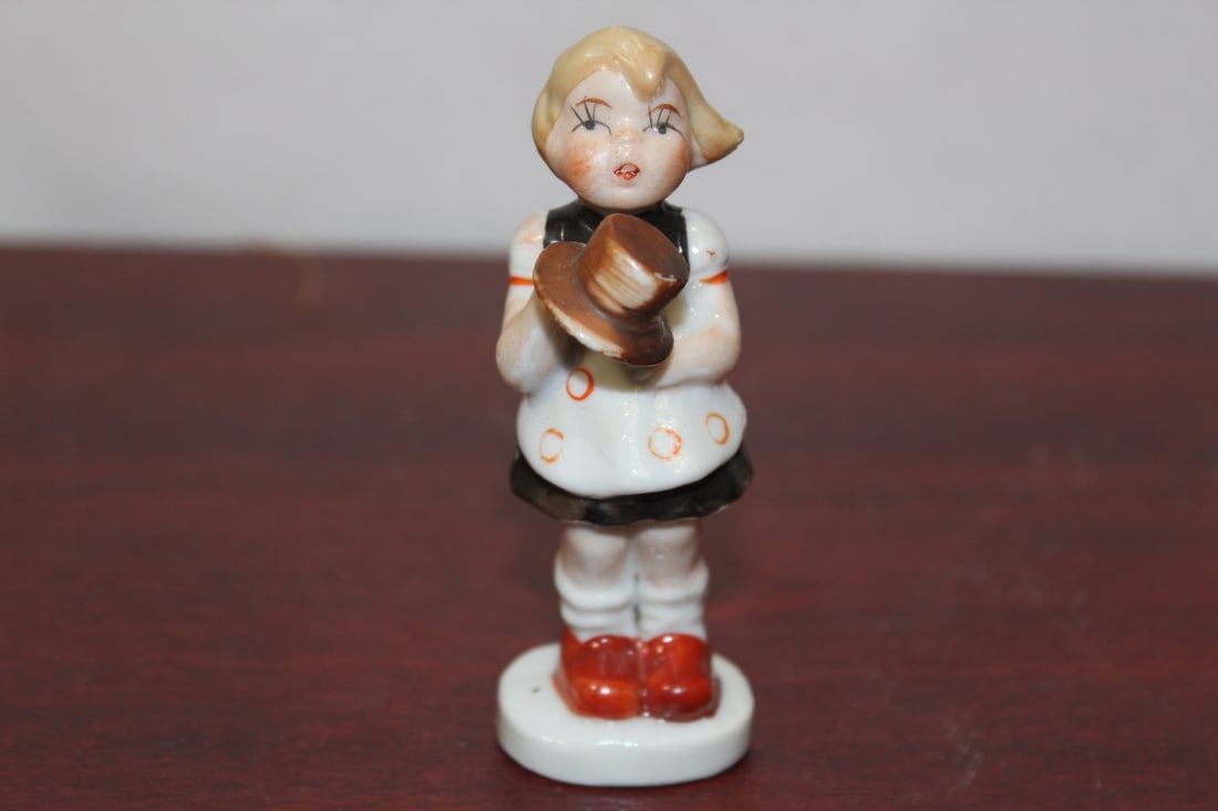A Ceramic Figurine: 3 3/8" tall