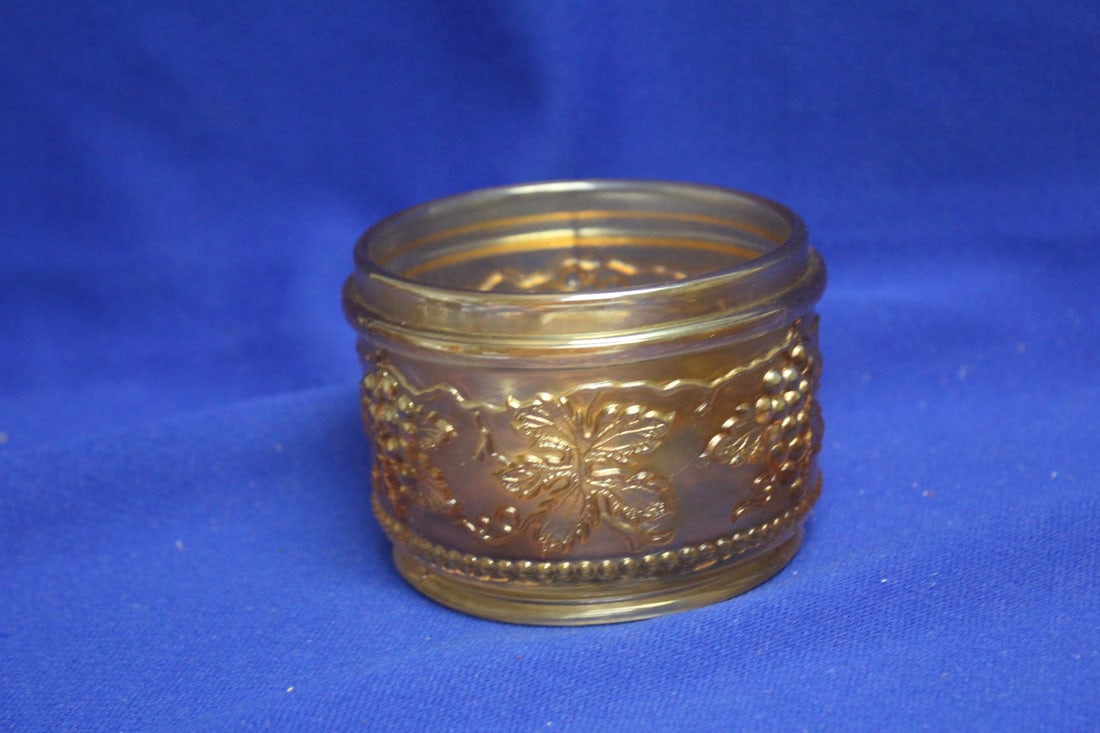 A Carnival Glass Container: 3 1/2" in diameter
