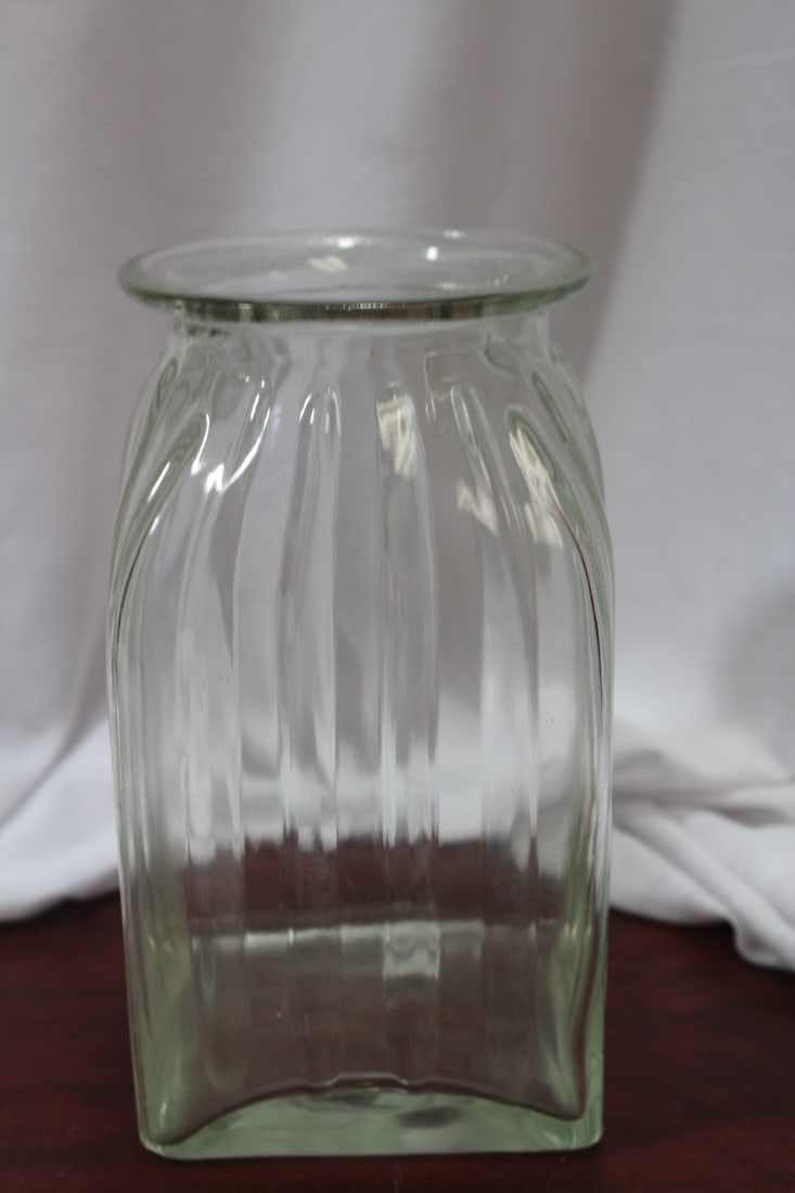 A Vintage Clear Glass Jar: 7 1/2" tall