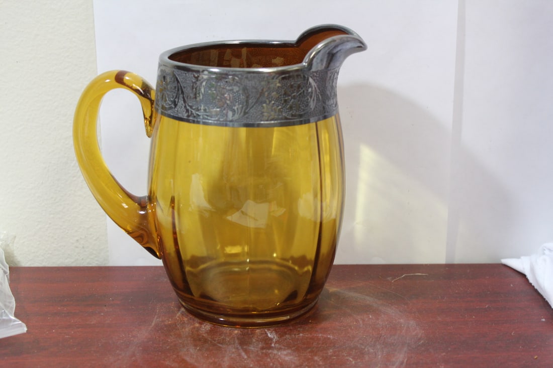 A Silver Overlay Amber Glass Pitcher: 8" tall
