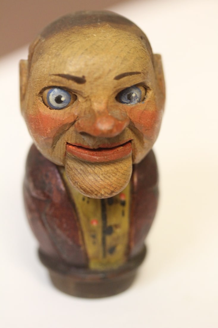 A Carved Wooden Stopper: 3 inches tall