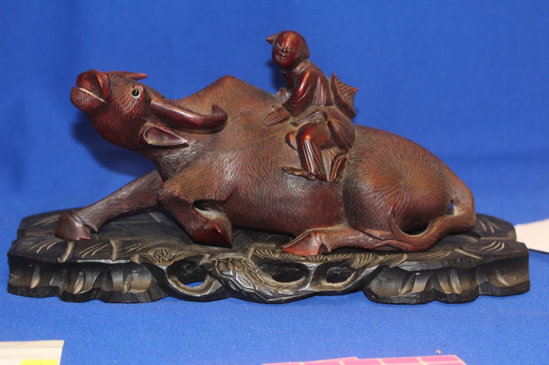 An Antique Chinese Ox with Boy Rider: on base - please note: age crack - overall= 117/8" across