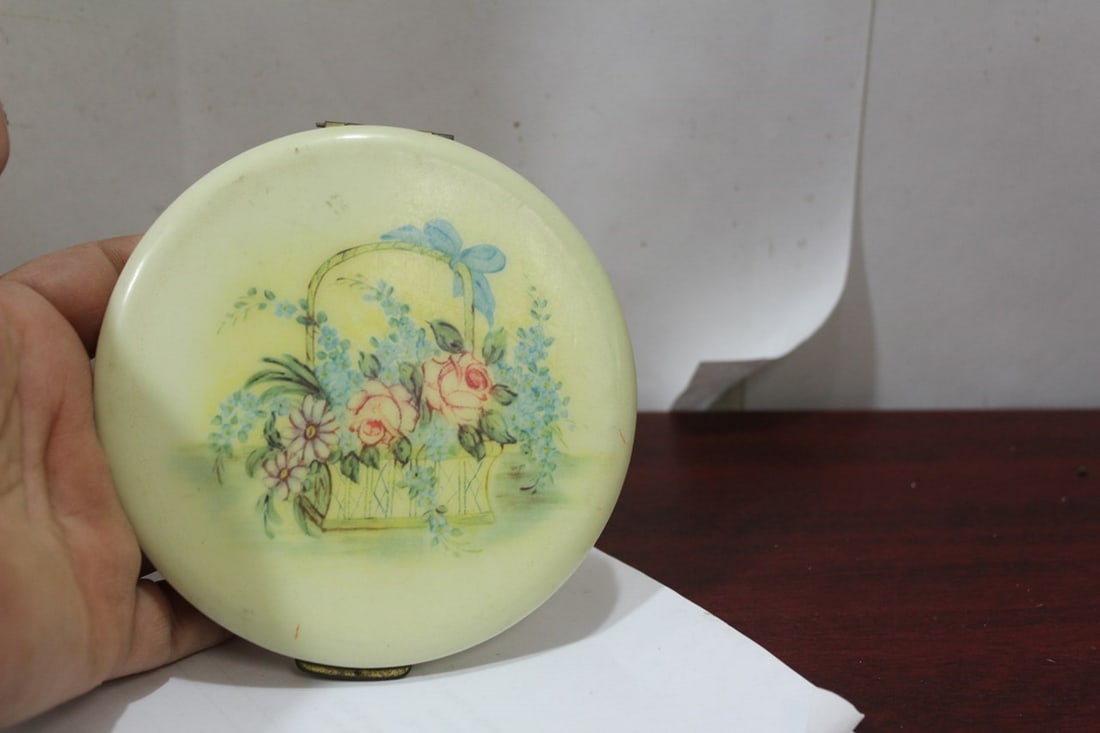 A Rex Fifth Avenue Celluloid Compact: 4 1/2" in diameter