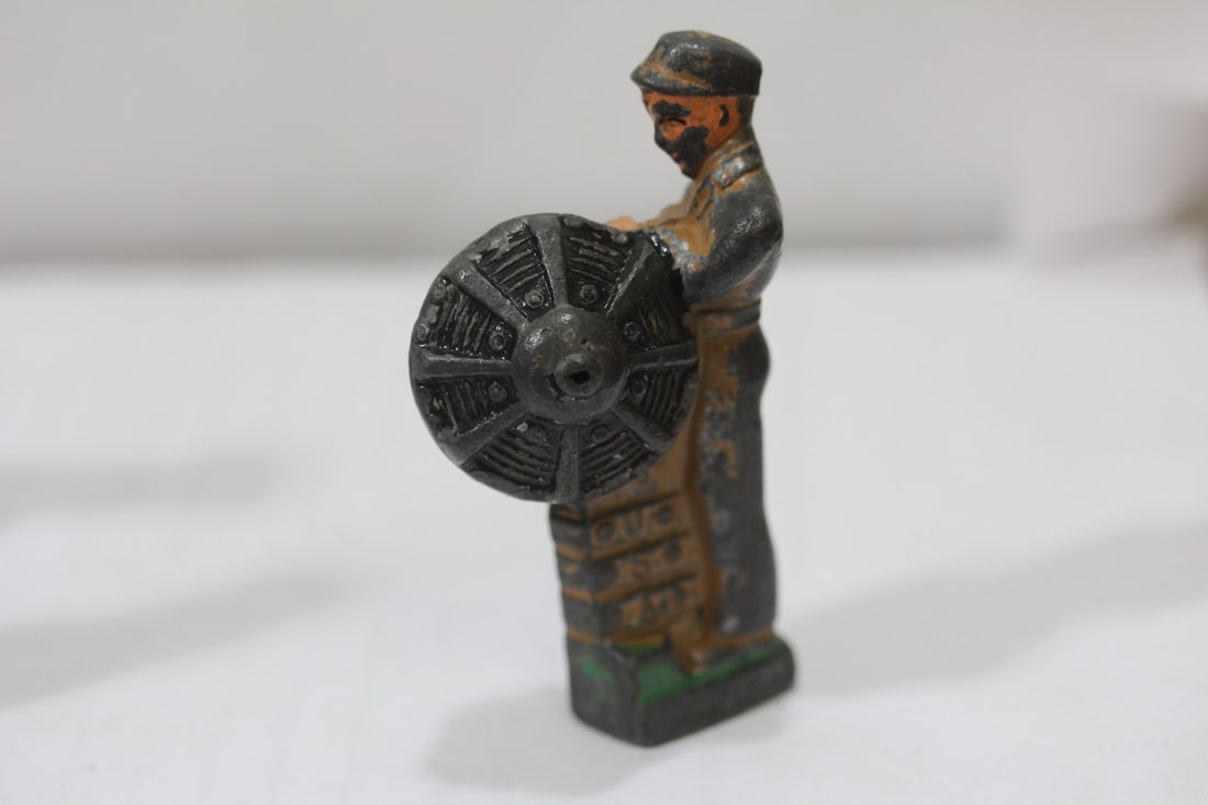 A Polychrome Worker Figurine - 2