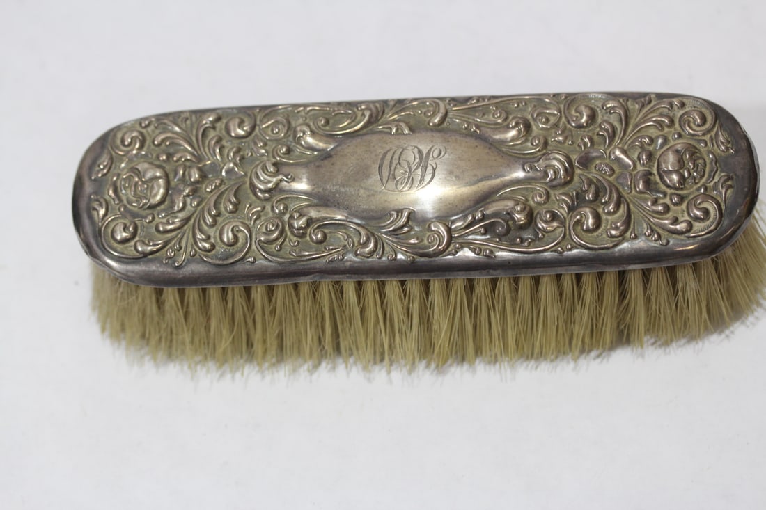 An Ornate Sterling Brush: please note: monogrammed - 7 inches long