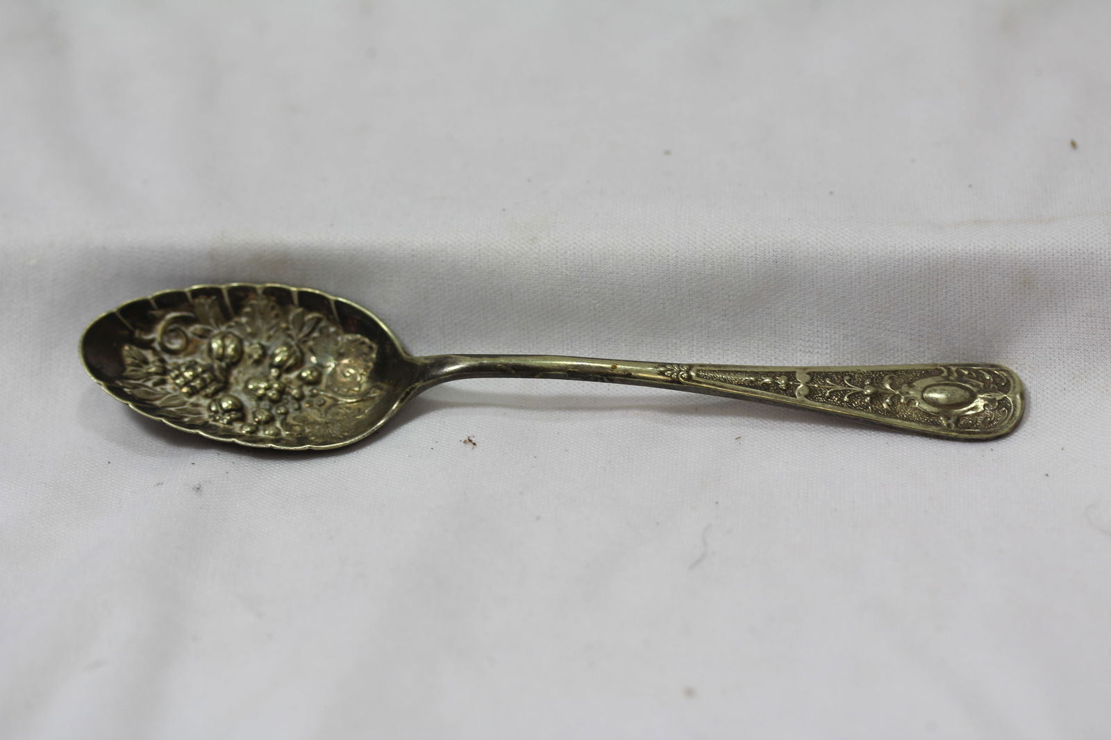 A Silver Plated Berry Spoon: 5 3/4" long
