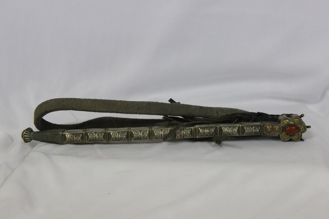 An Oriental Metal Ornament: Function unknown - made out of metal and leather - metal part 11 inches long