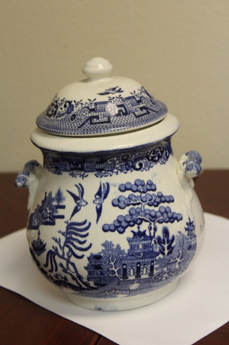 A Staffordshire Blue Willow Jar: with lid and two handles - 7 1/2" tall