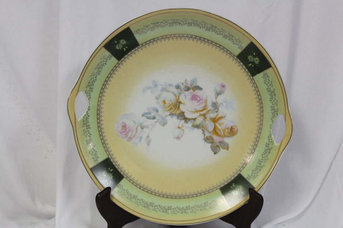 A Two Handle Plate: 11 inches in diameter