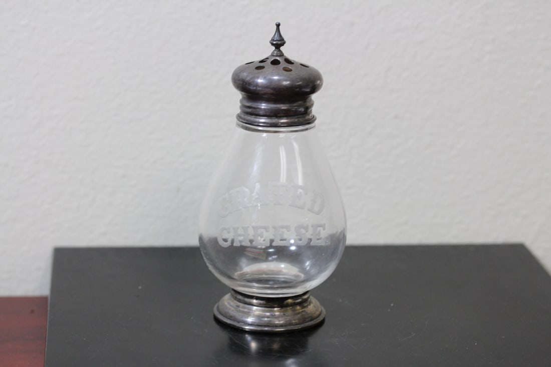 A Frank Whiting Grated Cheese Shaker: marked sterling - approximately 6" tall