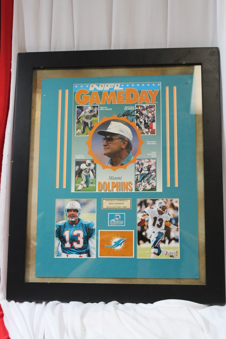 A Framed Game Day Poster: signed by Dan Marino - with COA on the back - overall= 22 1/2" x 18 1/2"