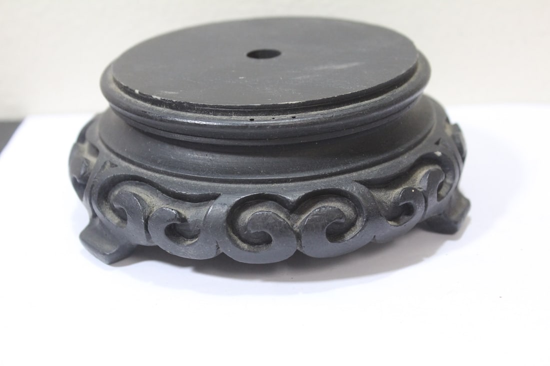 A Carved Stand: appears to be old - composite material - inside diameter - 4"