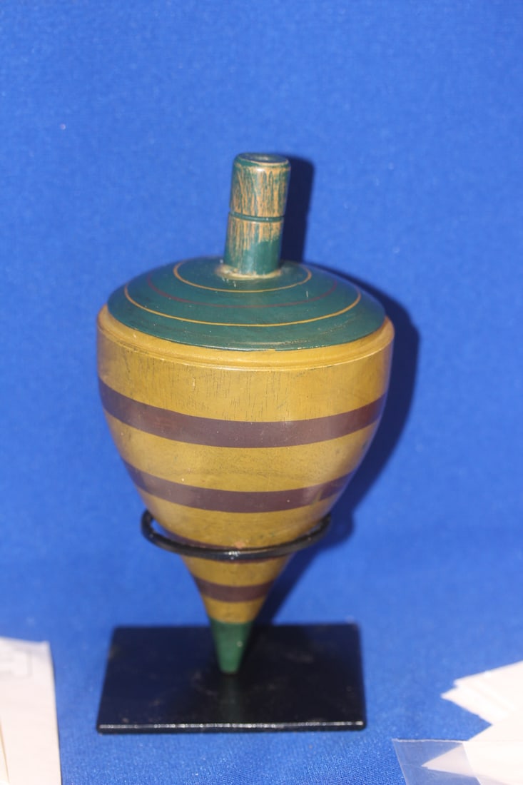 A Vintage Wooden Spinner: 7 inches tall