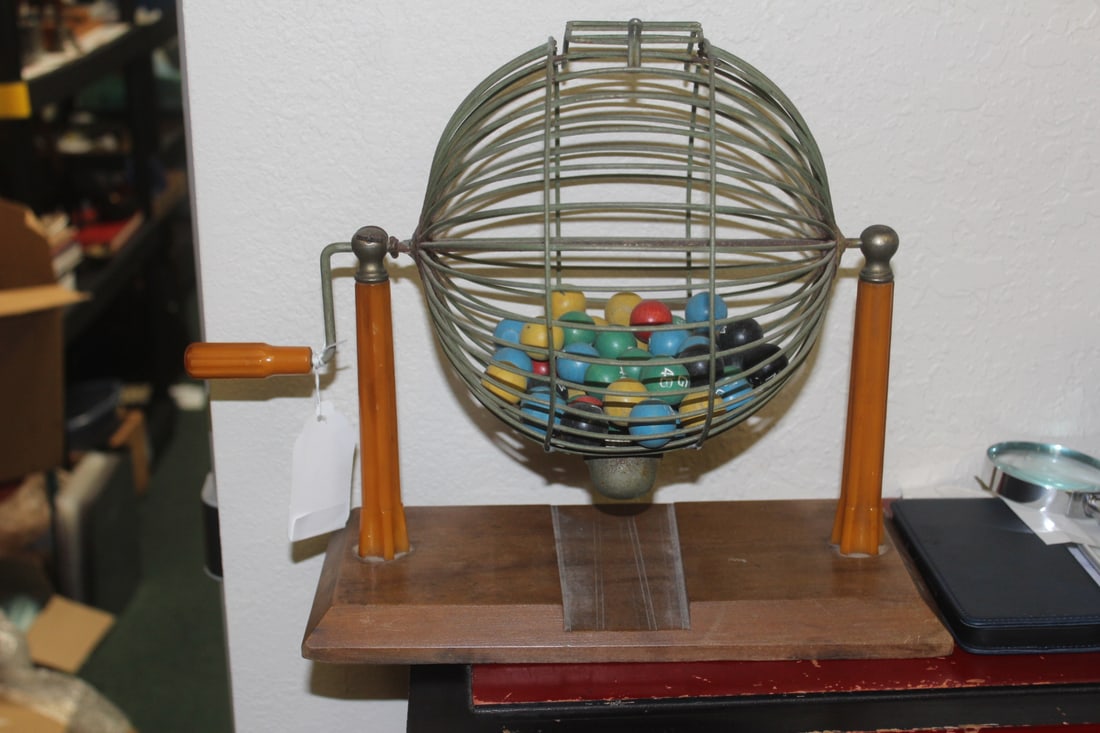 Bakelite Handle and Upright Bingo Machine: not counted how many bingo balls inside - 13" wide by 12" tall, including the handle