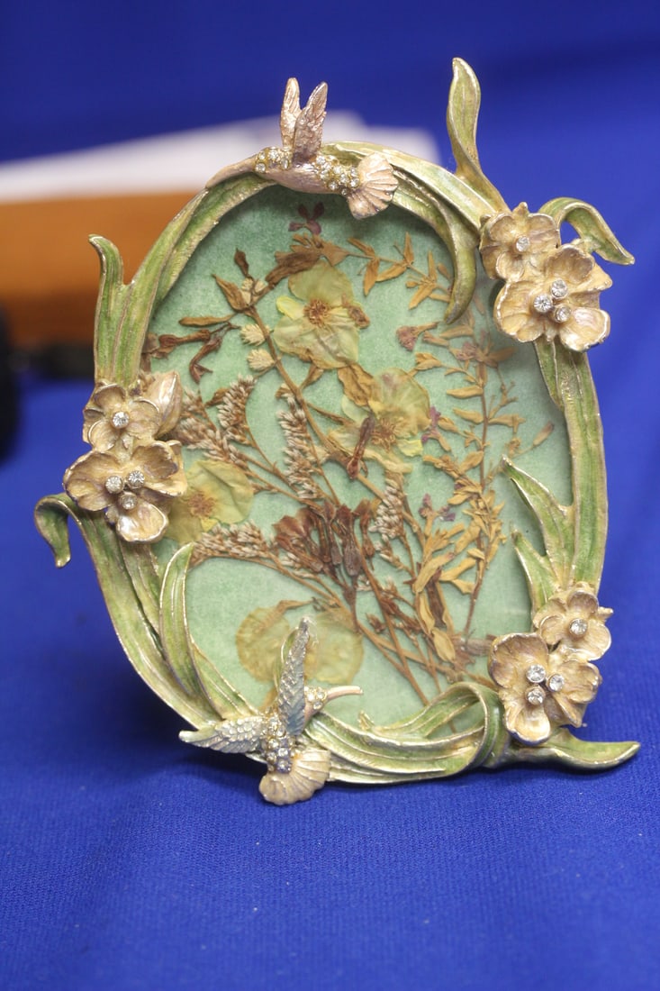 An EnamelMetal Victorian Flowers Frame: bird and flower - tallest= 6 inches
