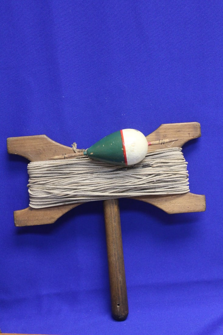 A Vintage Wooden Rope Fishing Reel: with lure? - 9 3/4" across