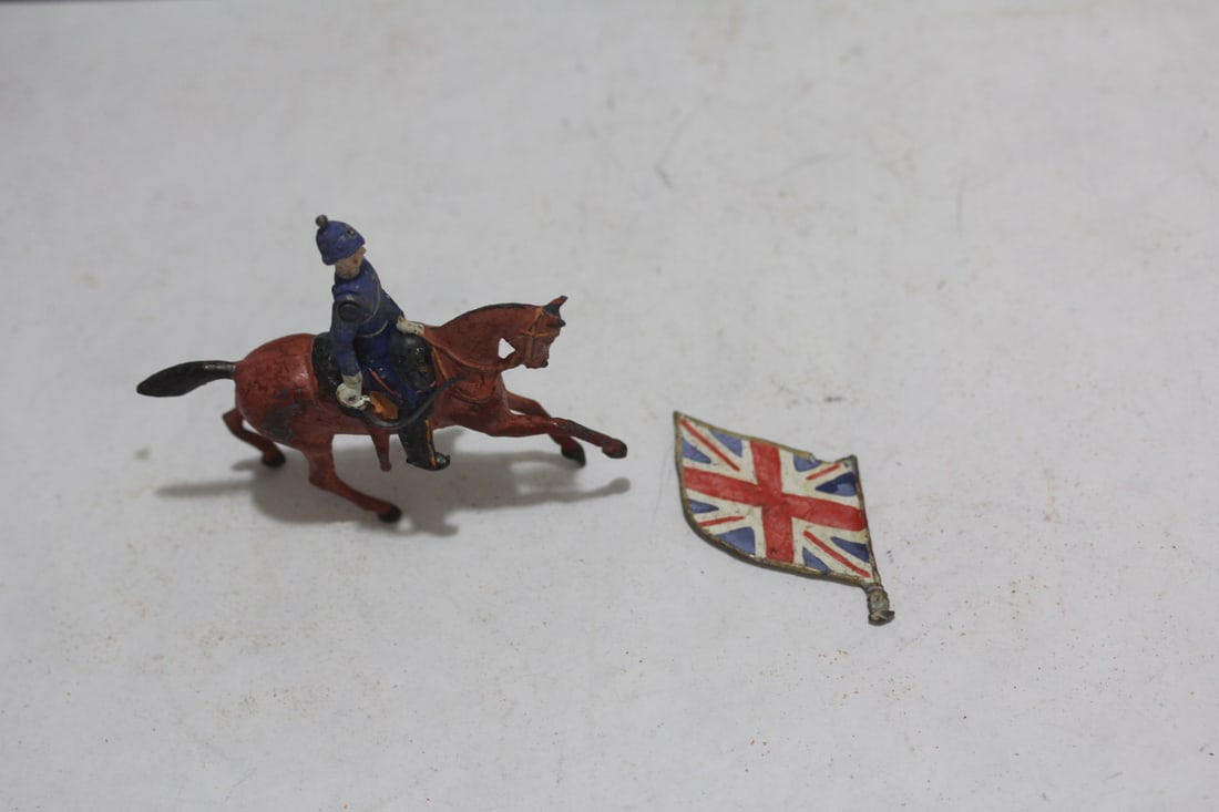An English Metal Soldier and Flag: arm= articulated - 3 1/4" across with metal British flag