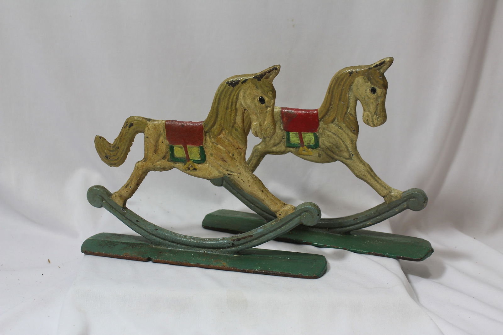 A Pair of Vintage Cast Iron Rocking Horses: 8 3/4" across- these are old, possibly mid 20th century or earlier