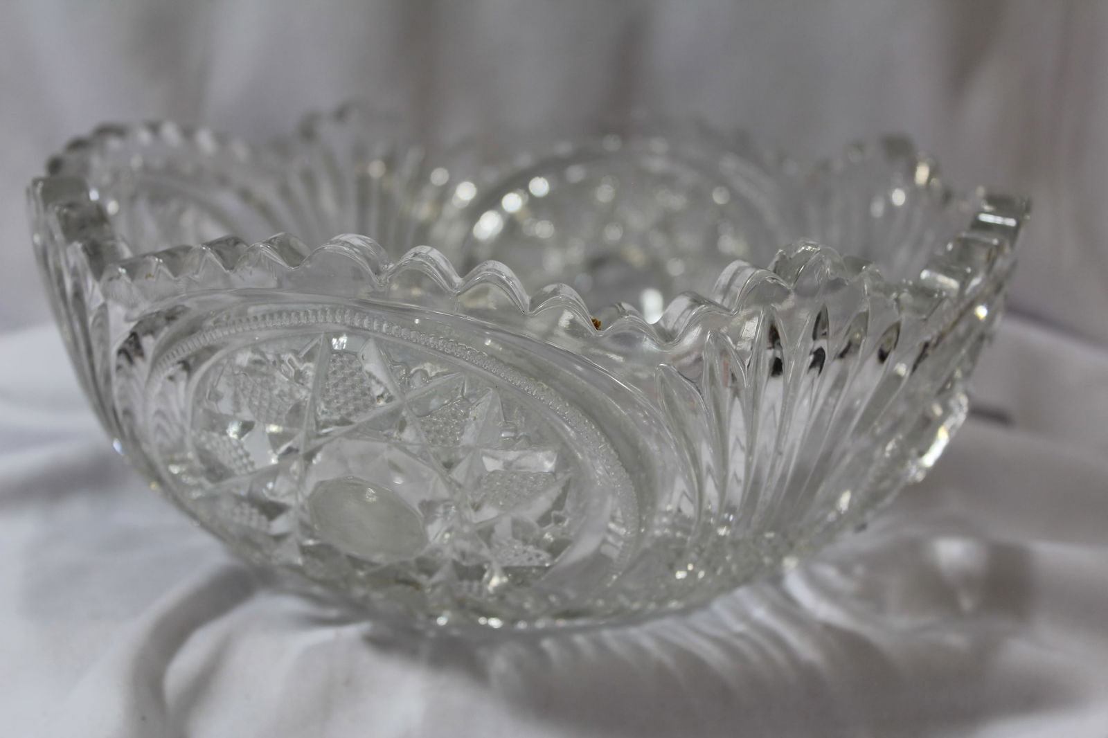 A Pressed Glass Bowl: please note: minor roughness on the rim - 8 3/4" in diameter