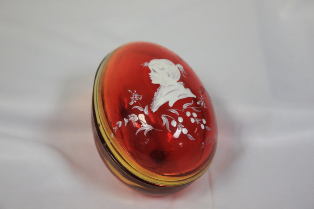 A New Orleans Ruby Red Glass Egg: Handpainted - artist signed - 3 1/2" in diameter