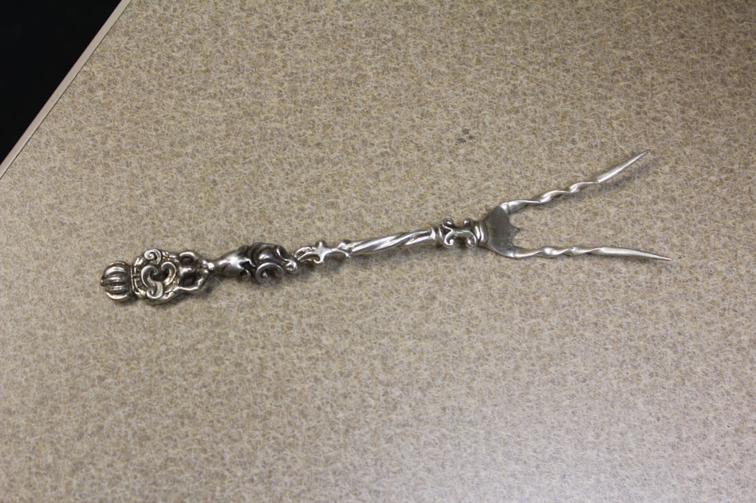 Very Ornate Potato Fork: marked "sterling" - rare find