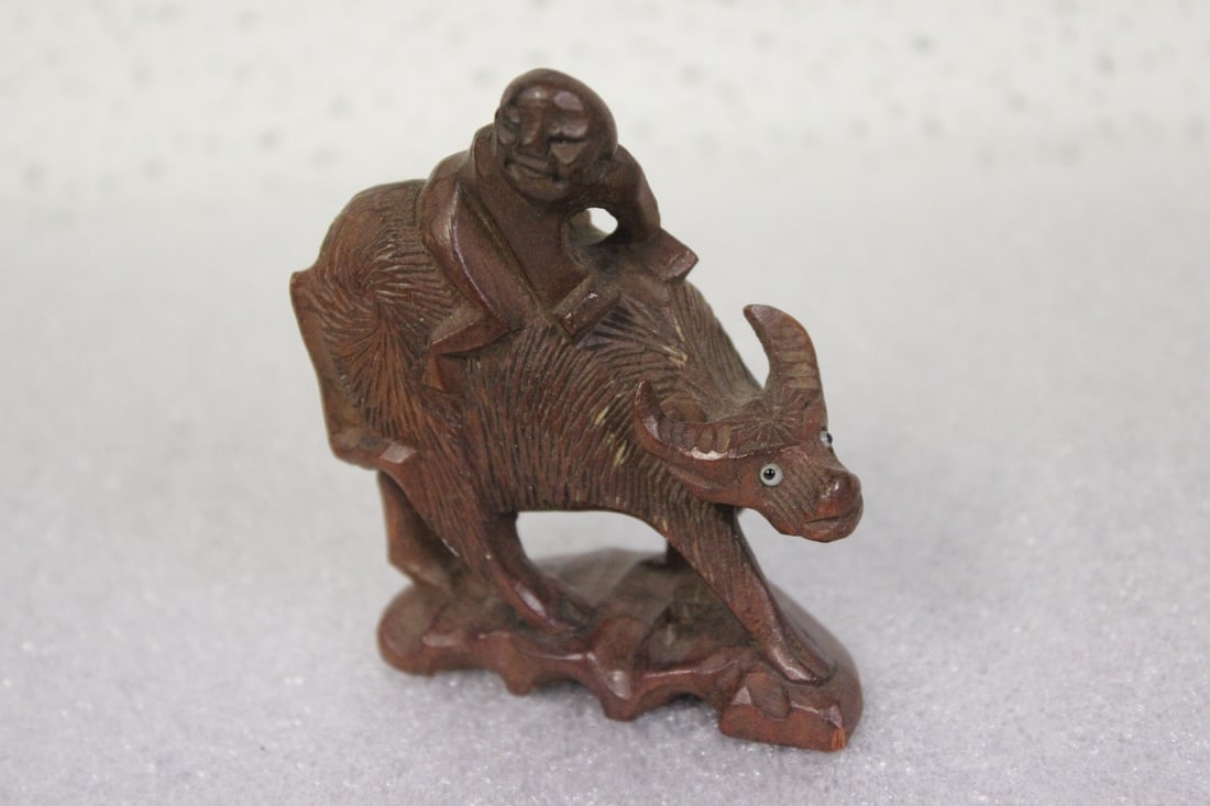 A Vintage Chinese Wooden Cow with Rider: 3" tall