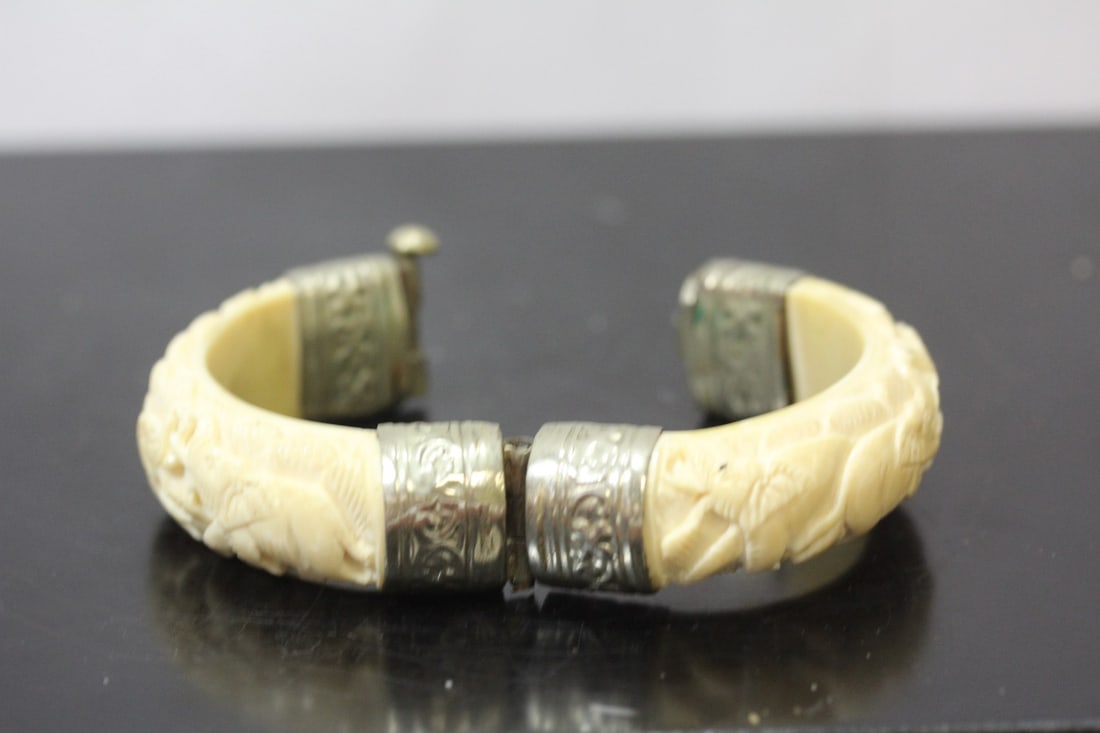 A Carved Bone Bracelet: inside diameter= 2 1/2"