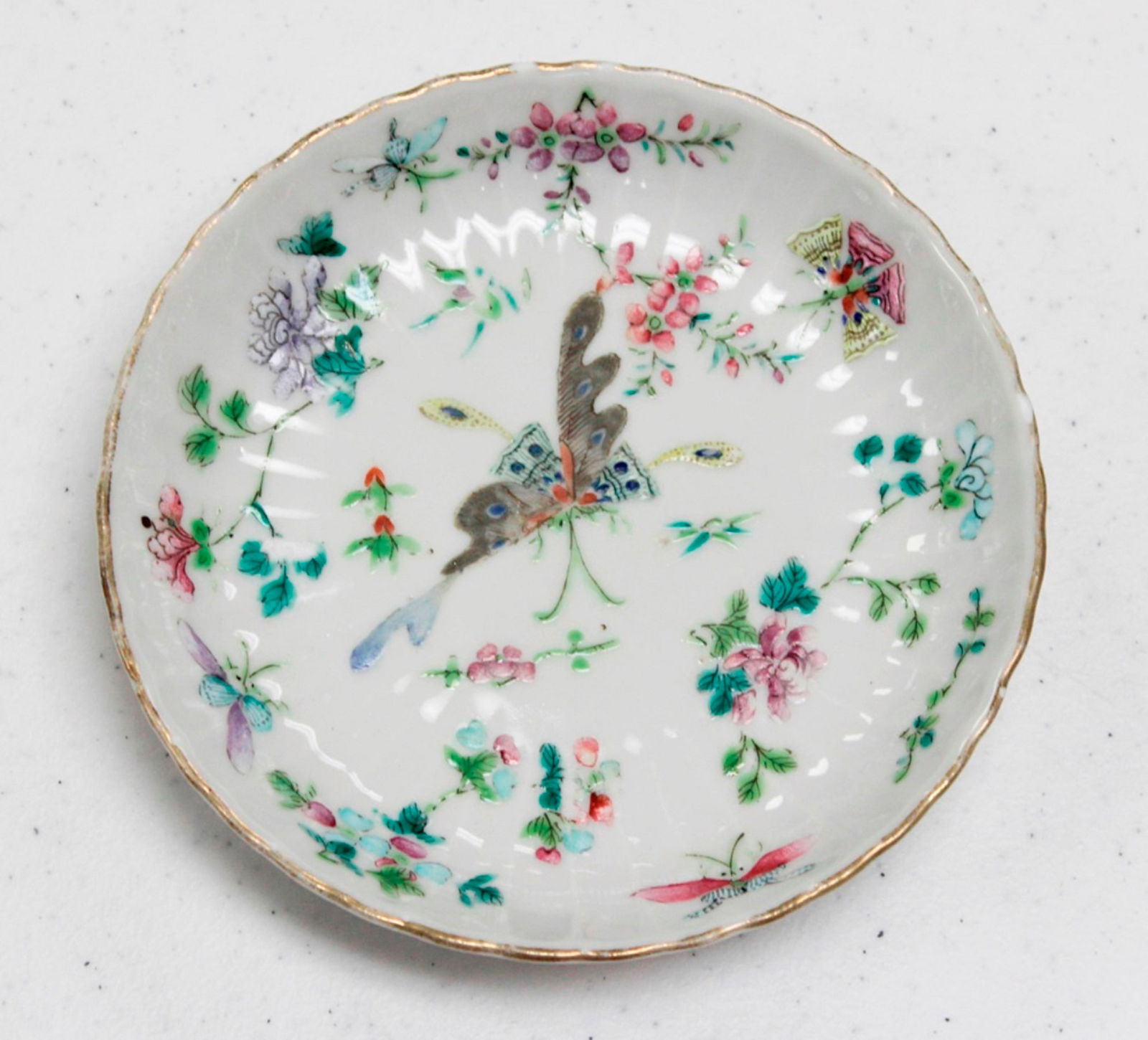 Qing Dynasty Small Dish: Most likely circa 19th C. Chinese. Measures 5 1/2" in diameter. Some minor enamel loss.