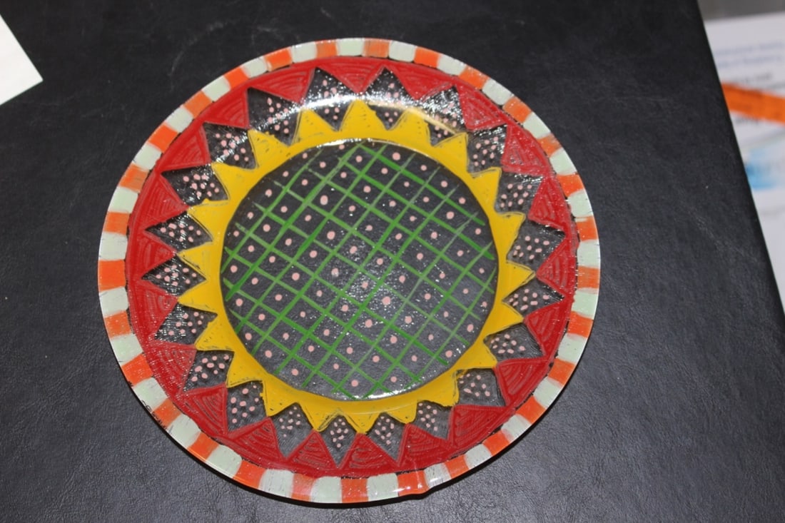 A Hand Painted Plate: 8 inches in diameter