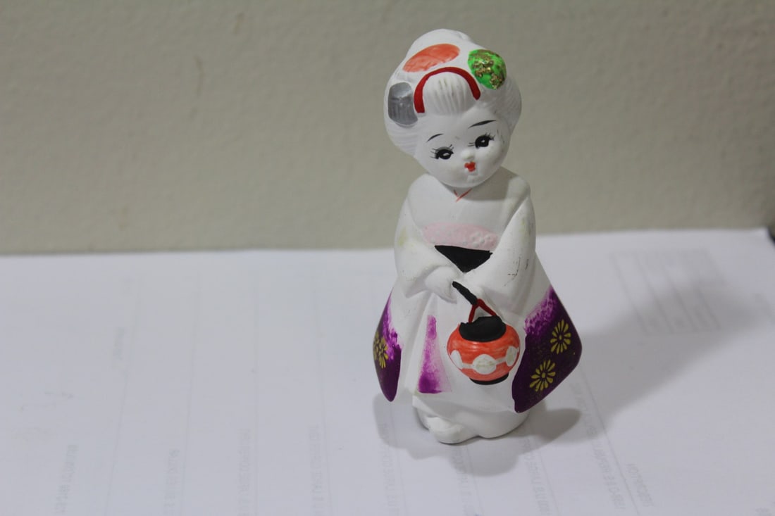 A Ceramic Japanese Figurine: 4" tall
