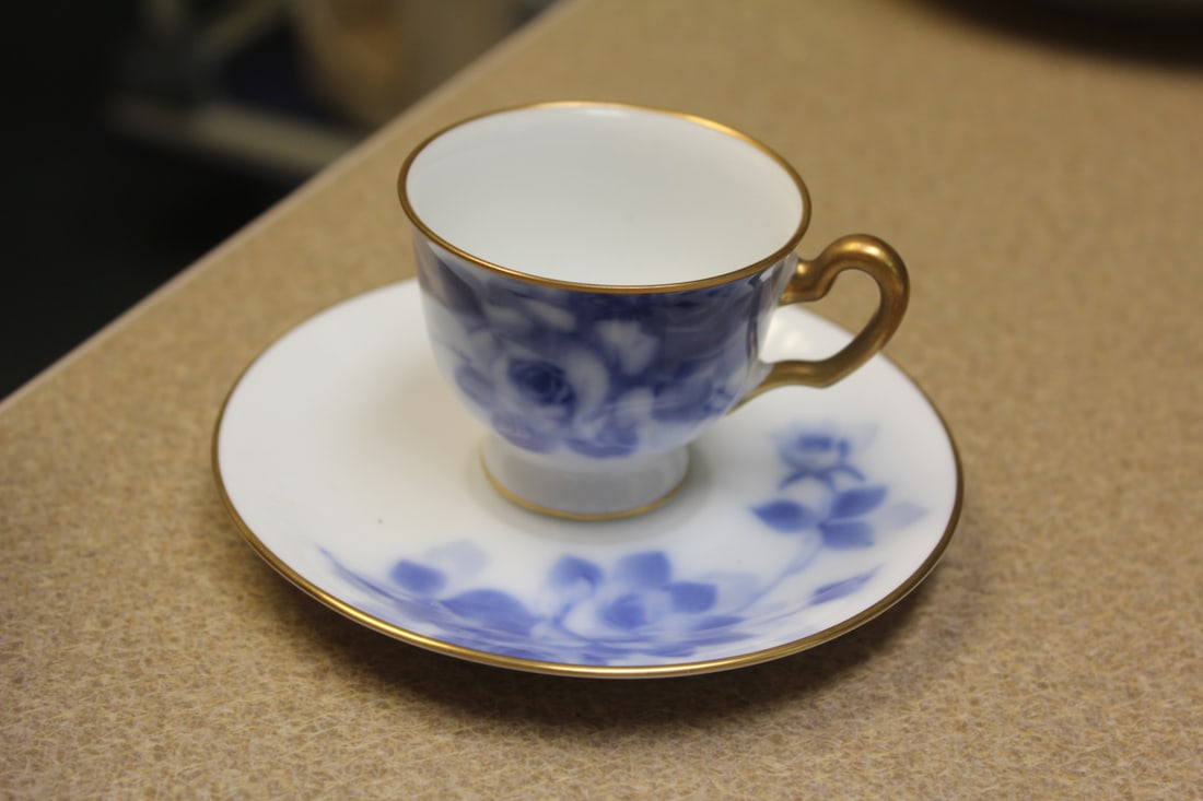 Flow Blue Cup and Saucer: cup= 1 7/8" tall