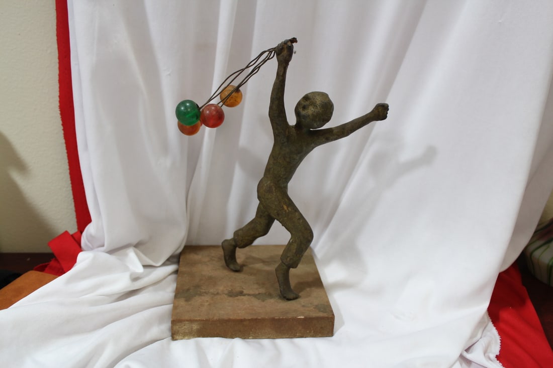 A Vintage/Antique Balloon Boy: brass/bronze/ other metal - heavy - balloon appears to be bakelite - stone base - 11" tall