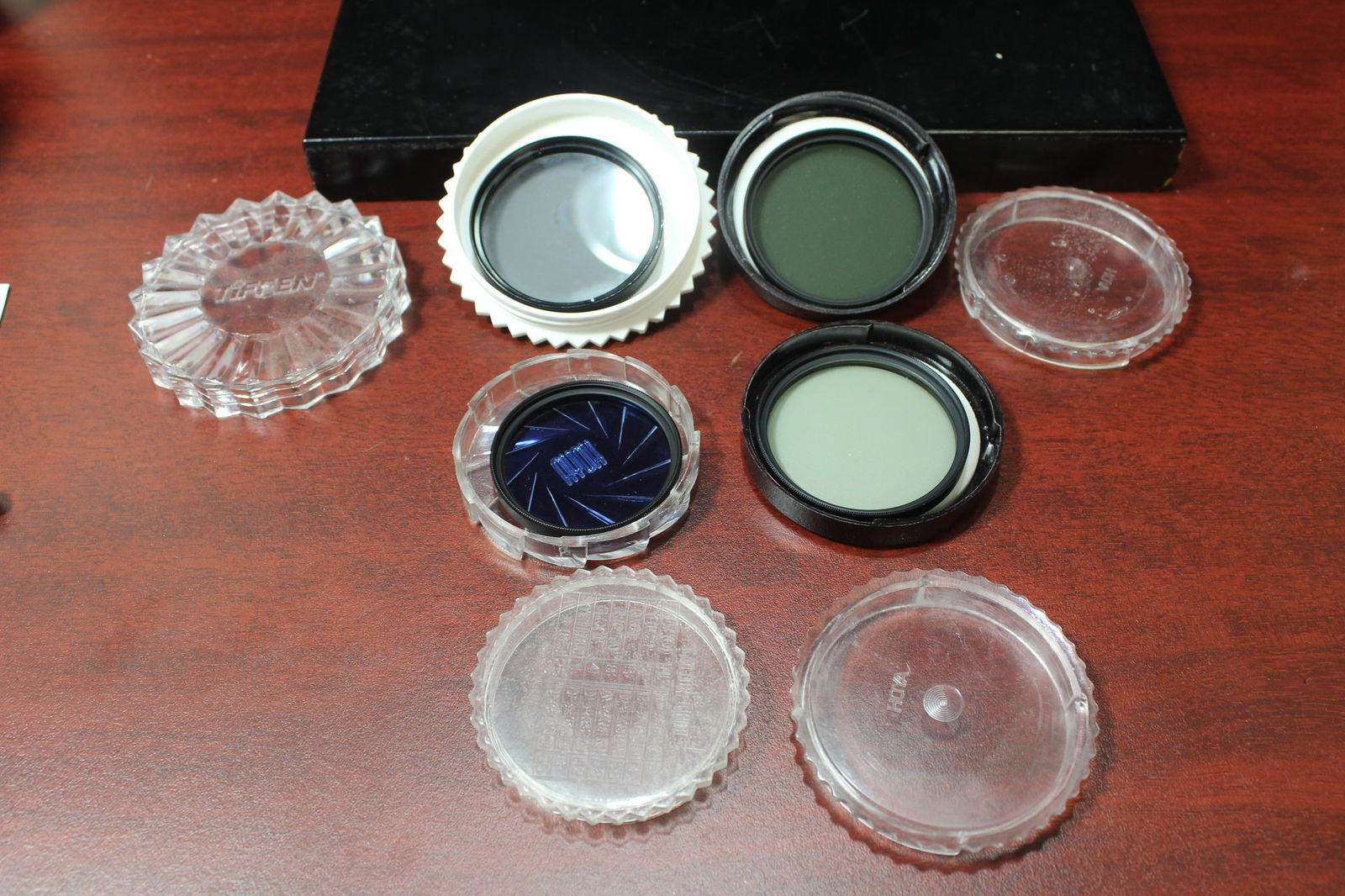 Lot of 4 Camera Filters: blue filter: HOYA HMC 46mm 80A Japan - lightest grey/green?: HOYA HMC 52mm NDX2 Japan - medium shade grey: TIFFEN CIR. Polarizer 52mm Japan - darkest of the four filters: HOYA HMC 52mm Japan