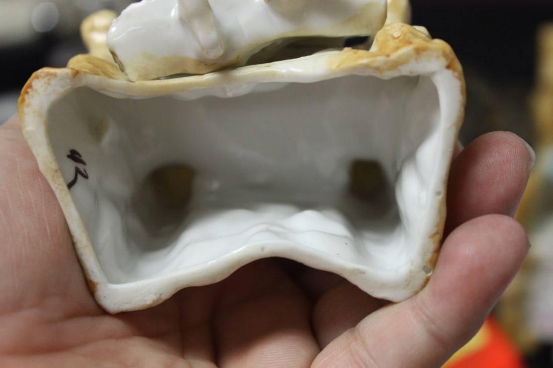 A Seated Ceramic Figure - 8