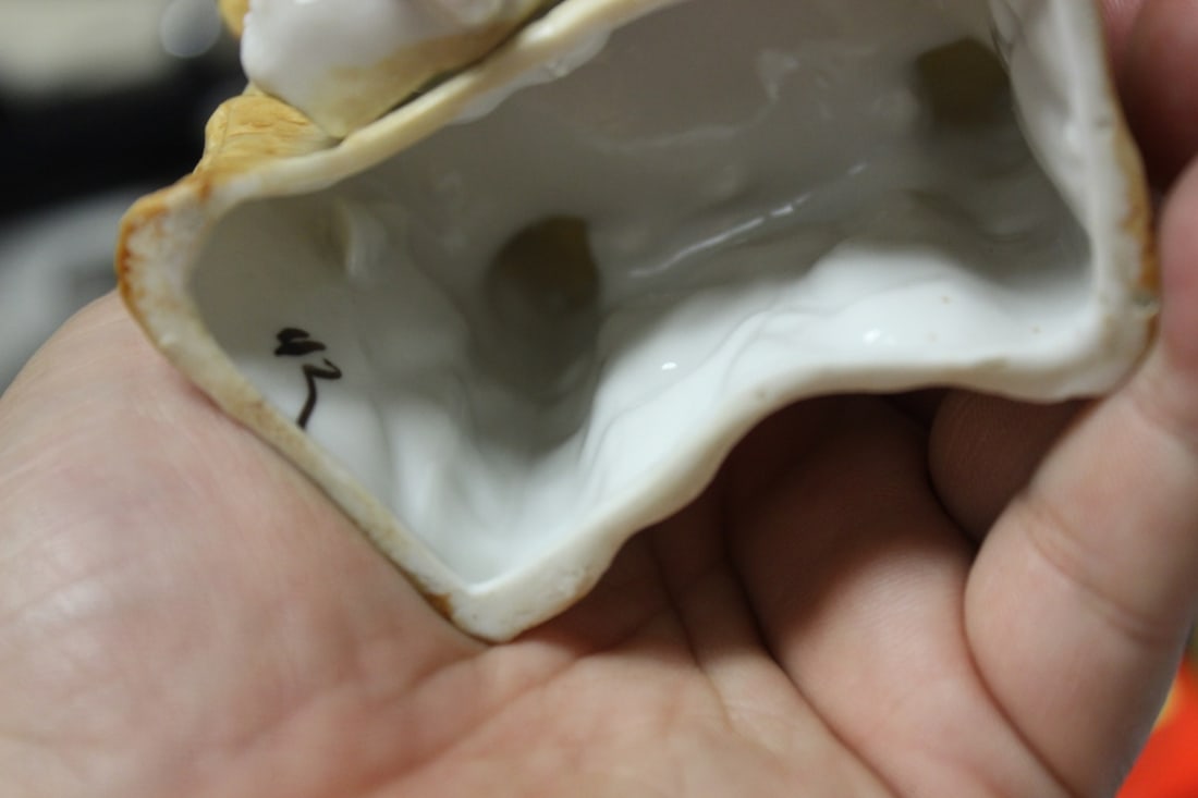 A Seated Ceramic Figure - 9