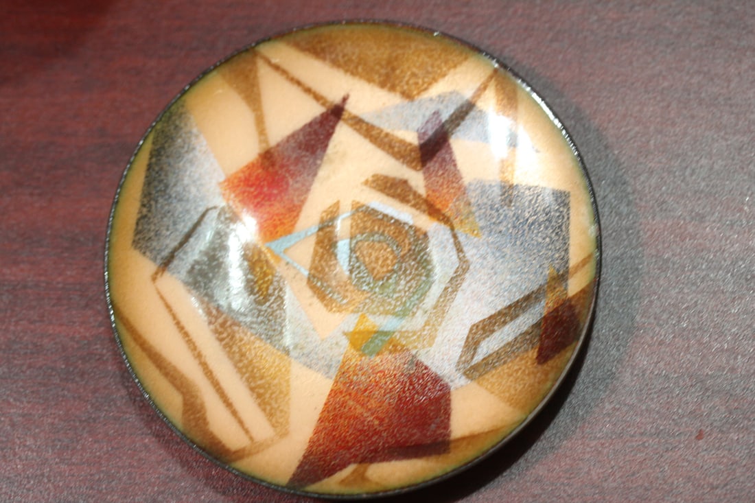 A Small Enamel Plate: marked on the bottom - 4 1/4" in diameter