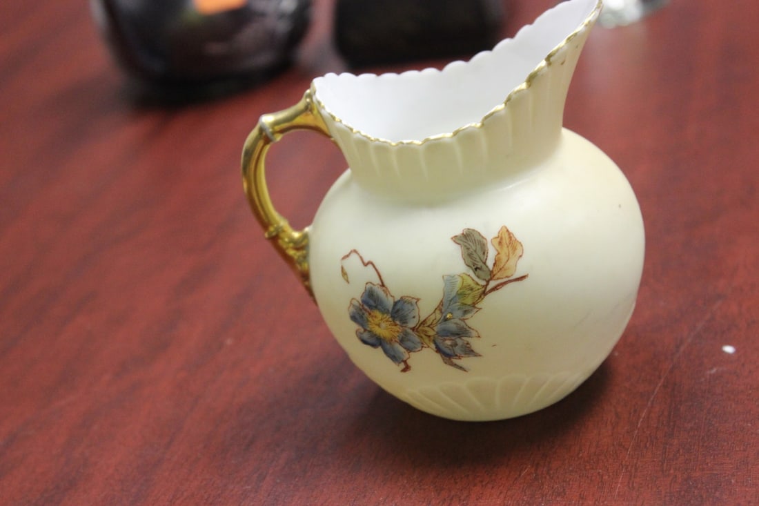 An Antique Rudolstadt Porcelain Creamer: German - handpainted - approximately 100 yrs old - 4" tall